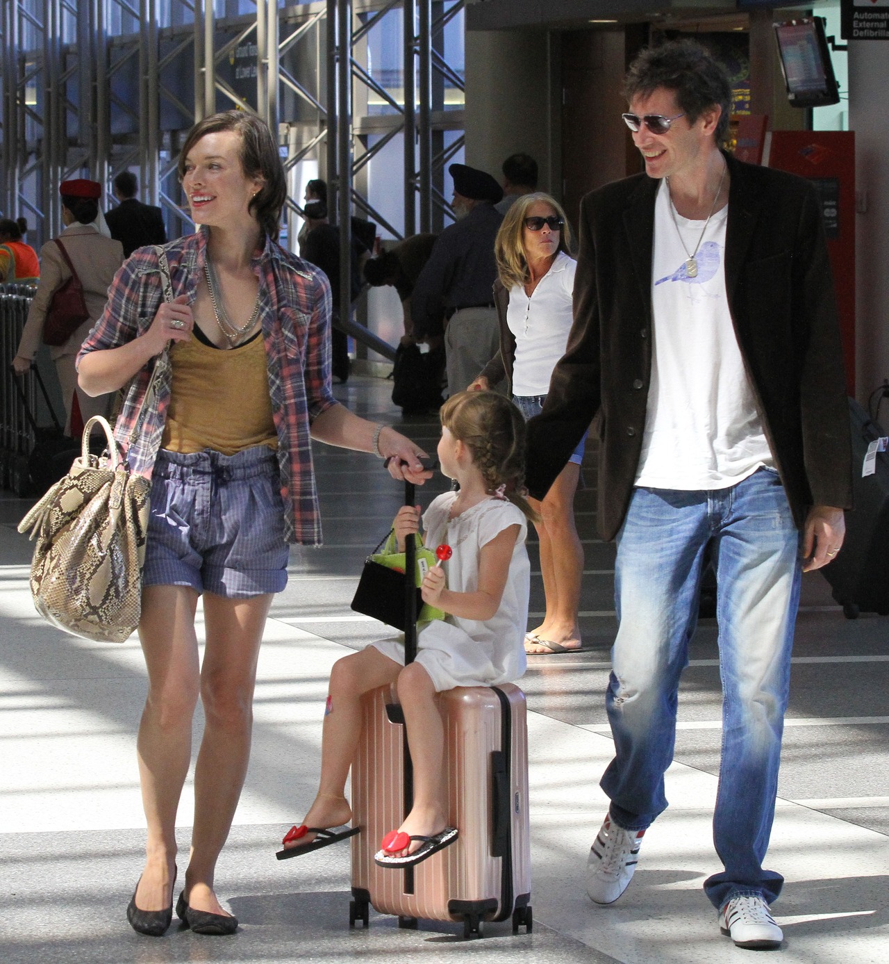 Milla Jovovich and family : Picture perfect at LAX